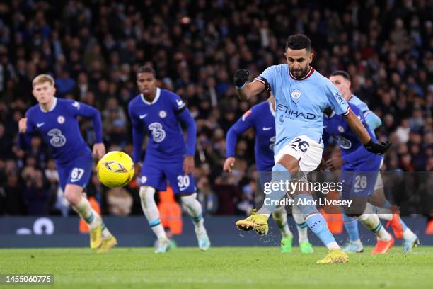 Riyad Mahrez of Manchester City scores the team's fourth goal from the penalty spot during the Emirates FA Cup Third Round match between Manchester...