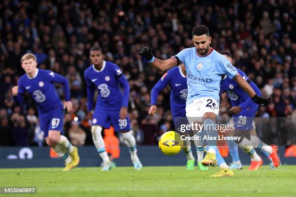 Riyad Mahrez of Manchester City scores the team's fourth goal from the penalty spot during the Emirates FA Cup Third Round match between Manchester...