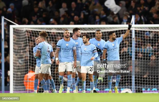 Riyad Mahrez of Manchester City celebrates after scoring the team's fourth goal during the Emirates FA Cup Third Round match between Manchester City...