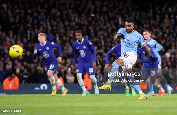 Riyad Mahrez of Manchester City scores the team's fourth goal from the penalty spot during the Emirates FA Cup Third Round match between Manchester...