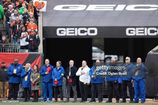 Members of the medical staff who worked on Damar Hamlin of the Buffalo Bills during his medical emergency stand during the national anthem prior to...