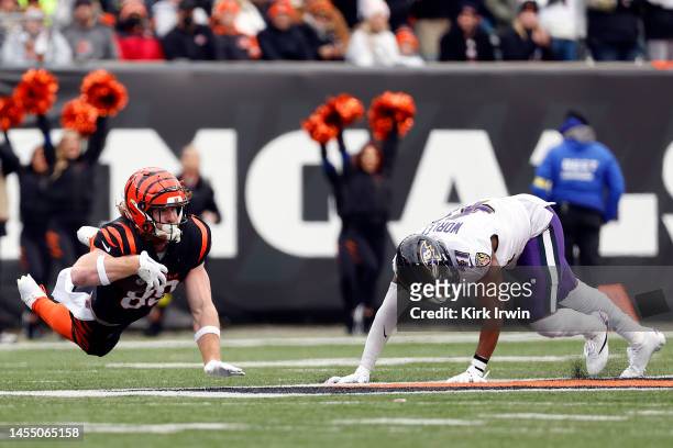 Hayden Hurst of the Cincinnati Bengals dives for a first down in front of Daryl Worley of the Baltimore Ravens during the first quarter at Paycor...
