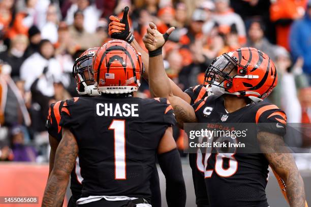 Joe Mixon of the Cincinnati Bengals celebrates his touchdown by doing a coin toss in the end zone during the first quarter against the Baltimore...