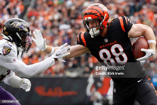 Hayden Hurst of the Cincinnati Bengals runs the ball against Marcus Williams of the Baltimore Ravens during the first half at Paycor Stadium on...
