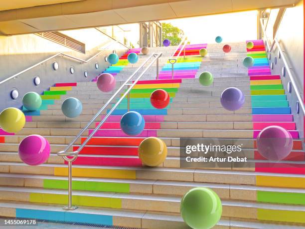 digital picture of a colorful balls falling in urban stairs with rainbow colors. - crazy party ストックフォトと画像