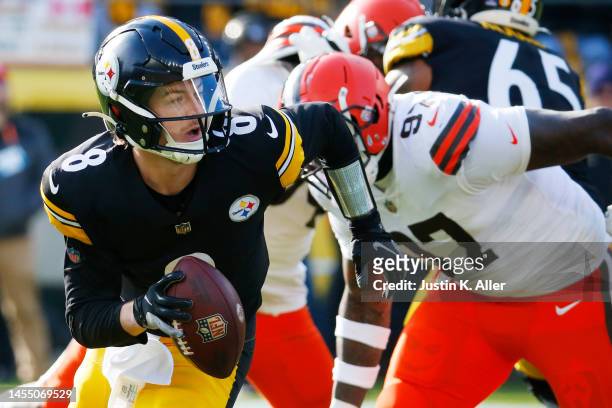 Kenny Pickett of the Pittsburgh Steelers runs with the ball during the first half of the game against the Cleveland Browns at Acrisure Stadium on...
