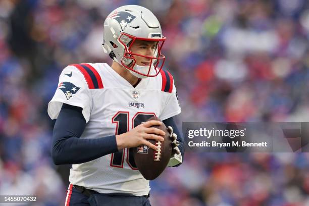 Mac Jones of the New England Patriots warms up prior to a game against the Buffalo Bills at Highmark Stadium on January 08, 2023 in Orchard Park, New...
