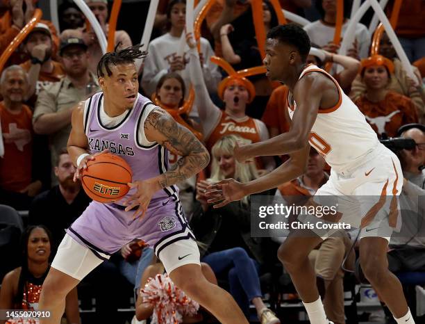 Keyontae Johnson of the Kansas State Wildcats holds the ball away from Sir'Jabari Rice of the Texas Longhorns during the game between Kansas State...