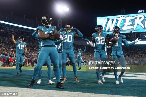 Jacksonville Jaguars defensive players celebrate an interception by Tyson Campbell during the second half against the Tennessee Titans at TIAA Bank...