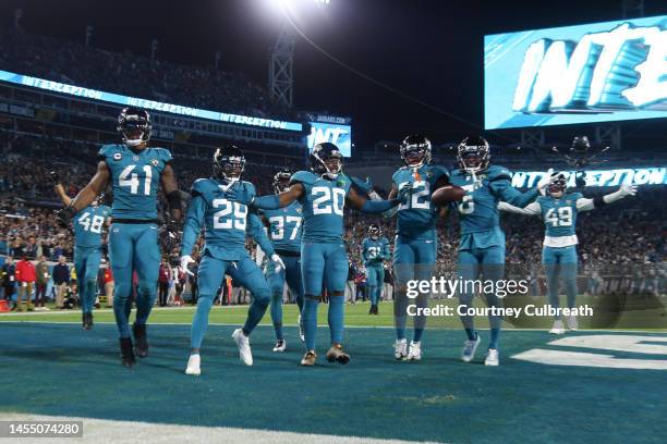 Jacksonville Jaguars defensive players celebrate an interception by Tyson Campbell during the second half against the Tennessee Titans at TIAA Bank...