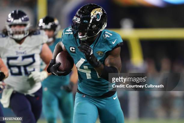 Josh Allen of the Jacksonville Jaguars returns the ball stripped by Rayshawn Jenkins for a touchdown during the second half against the Tennessee...
