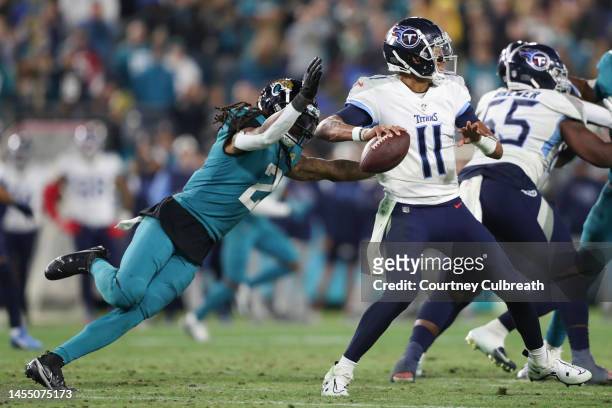 Rayshawn Jenkins of the Jacksonville Jaguars strips the ball from Joshua Dobbs of the Tennessee Titans during the second half at TIAA Bank Field on...