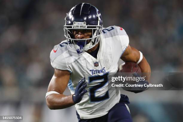 Robert Woods of the Tennessee Titans carries the ball during the first half against the Jacksonville Jaguars at TIAA Bank Field on January 07, 2023...