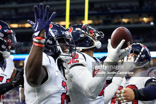 Jonathan Greenard of the Houston Texans celebrates after an interception returned for a touchdown during the game against the Indianapolis Colts at...