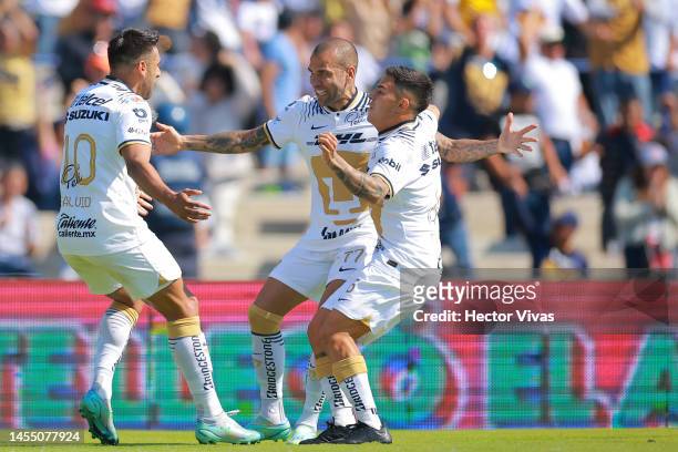 Eduardo Salvio of Pumas UNAM celebrates with teammates after scoring their team's first goal during the 1st round match between Pumas UNAM and FC...
