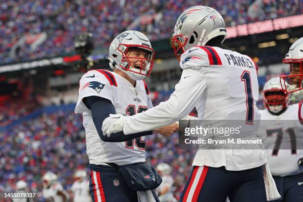 Mac Jones of the New England Patriots celebrates with DeVante Parker of the New England Patriots after Parker's receiving touchdown during the second...