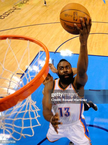 James Harden of the Oklahoma City Thunder lays the ball up against the San Antonio Spurs in Game Three of the Western Conference Finals of the 2012...