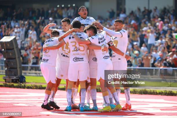 Juan Dinenno of Pumas UNAM celebrates with teammates after scoring their team's second goal during the 1st round match between Pumas UNAM and FC...