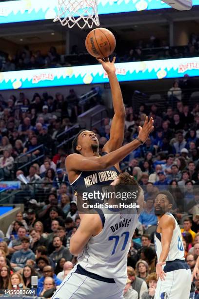 Herbert Jones of the New Orleans Pelicans moves to the basket over Luka Doncic of the Dallas Mavericks during the second half at American Airlines...
