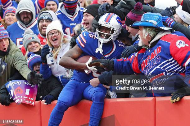 John Brown of the Buffalo Bills celebrates with fans after catching a touchdown pass during the third quarter against the New England Patriots at...