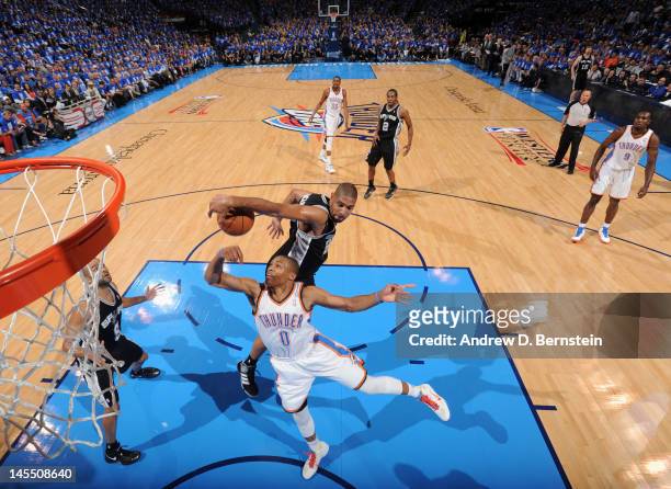 Oklahoma City, OKTim Duncan of the San Antonio Spurs blocks the shot of Russell Westbrook of the Oklahoma City Thunder from behind in Game Three of...