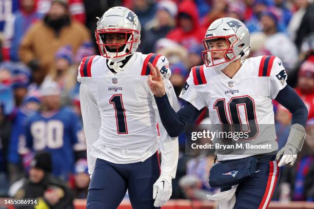 DeVante Parker of the New England Patriots and Mac Jones of the New England Patriots celebrate after Parker's touchdown reception during the fourth...
