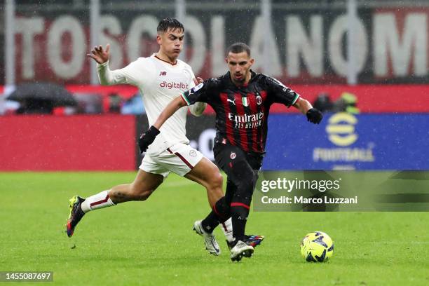 Ismael Bennacer of AC Milan is challenged by Paulo Dybala of AS Roma during the Serie A match between AC Milan and AS Roma at Stadio Giuseppe Meazza...