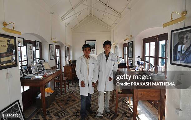 To go with story 'Lifestyle-Nepal-US-fashion-Everest' by Frankie Taggart Nepalese watchmakers Ang Namgel Sherpa and Lakpa Thundu Sherpa are pictured...