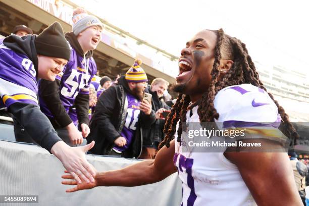 Osborn of the Minnesota Vikings high fives fans during the second half of the game against the Chicago Bears at Soldier Field on January 08, 2023 in...