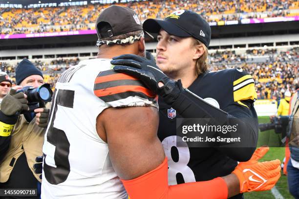 Kenny Pickett of the Pittsburgh Steelers embraces Myles Garrett of the Cleveland Browns after the game at Acrisure Stadium on January 08, 2023 in...