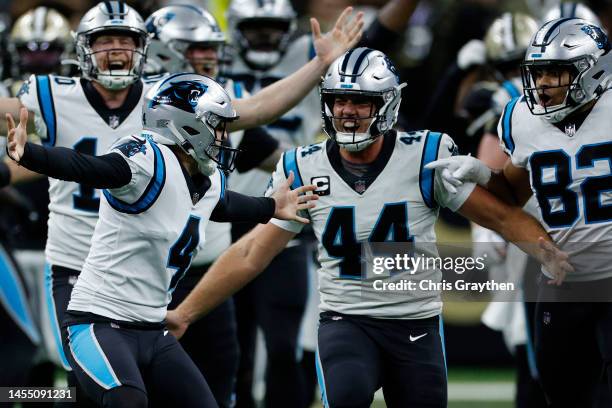 Eddy Pineiro of the Carolina Panthers celebrates with teammates after kicking a game winning field goal during the fourth quarter against the New...