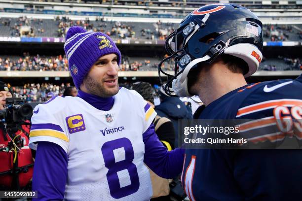 Kirk Cousins of the Minnesota Vikings talks with Nathan Peterman of the Chicago Bears after the game at Soldier Field on January 08, 2023 in Chicago,...