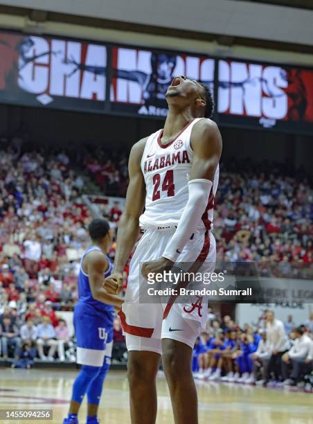 Brandon Miller of the Alabama Crimson Tide reacts after knocking down a basket and getting a foul call to send him to the free throw line during the...