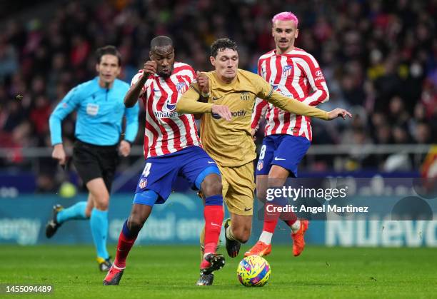 Andreas Christensen of FC Barcelona is challenged by Geoffrey Kondogbia of Atletico Madrid during the LaLiga Santander match between Atletico de...