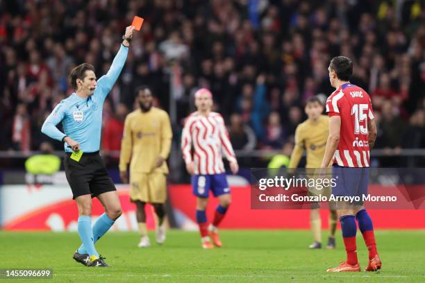 Stefan Savic of Atletico Madrid is shown a red card by referee Jose Luis Munuera Montero during the LaLiga Santander match between Atletico de Madrid...