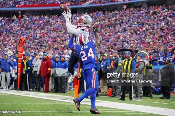 DeVante Parker of the New England Patriots catches a touchdown pass over Kaiir Elam of the Buffalo Bills during the fourth quarter at Highmark...