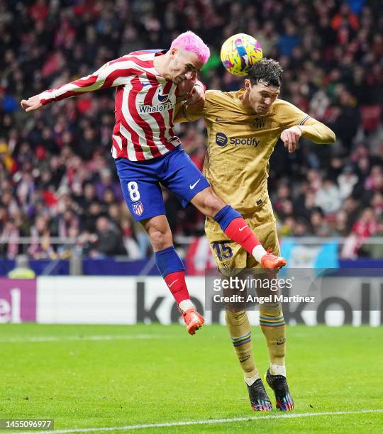 Antoine Griezmann of Atletico Madrid battles for possession with Andreas Christensen of FC Barcelona during the LaLiga Santander match between...