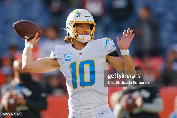 Justin Herbert of the Los Angeles Chargers warms up prior to a game against the Denver Broncos at Empower Field At Mile High on January 08, 2023 in...