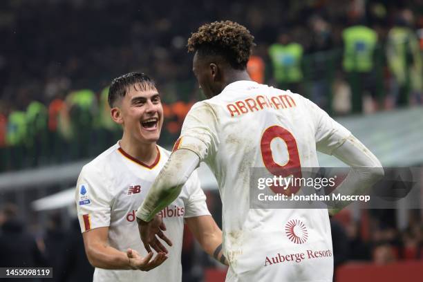 Tammy Abraham of AS Roma celebrates with team mate Paulo Dybala after scoring in injury time to level the game at 2-2 during the Serie A match...