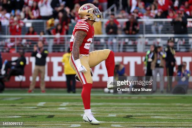 Elijah Mitchell of the San Francisco 49ers celebrates after running the ball for a touchdown during the second quarter against the Arizona Cardinals...