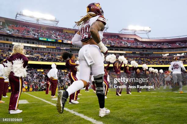 Chase Young of the Washington Commanders walks onto the field prior to the game against the Dallas Cowboys at FedExField on January 08, 2023 in...