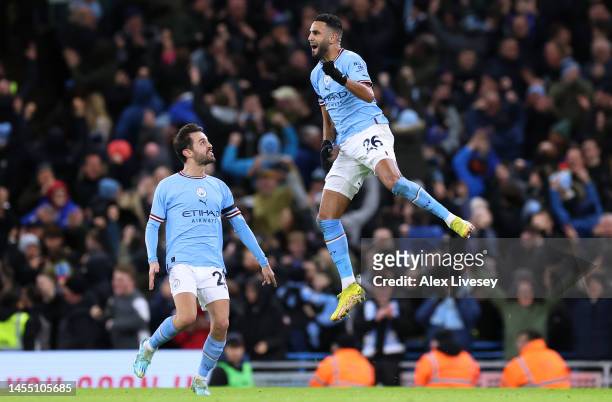 Riyad Mahrez of Manchester City celebrates after scoring the team's first goal during the Emirates FA Cup Third Round match between Manchester City...