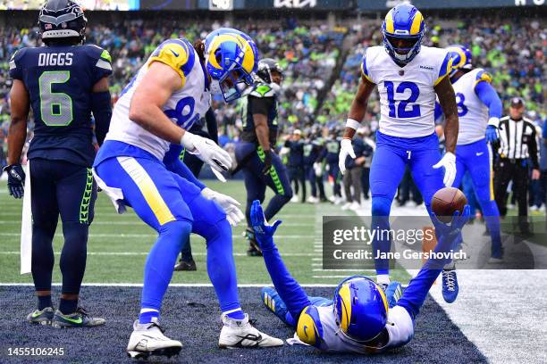 Tutu Atwell of the Los Angeles Rams celebrates with teammates after scoring a touchdown during the second quarter against the Seattle Seahawks at...
