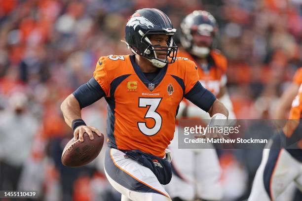 Russell Wilson of the Denver Broncos attempts a pass during the third quarter against the Los Angeles Chargers at Empower Field At Mile High on...