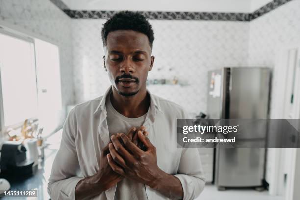 portrait of a man at home - hand on chest stock pictures, royalty-free photos & images