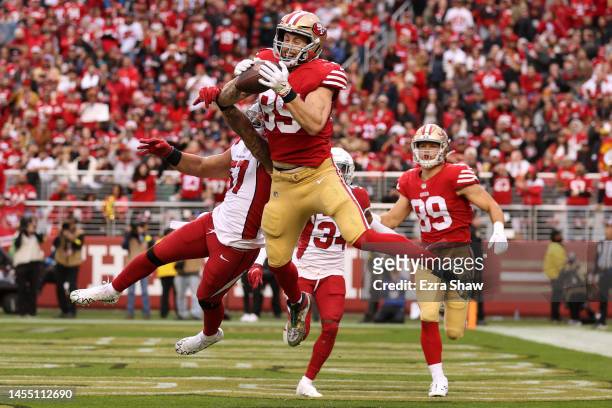 George Kittle of the San Francisco 49ers catches a pass against Kamu Grugier-Hill of the Arizona Cardinals for a touchdown during the third quarter...