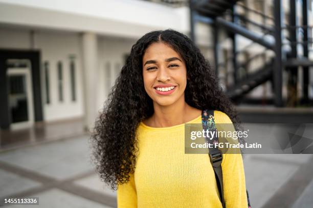 portrait of a young woman at university - hispanic teen girl stock pictures, royalty-free photos & images