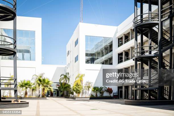 view of the university buildings - public school building stock pictures, royalty-free photos & images