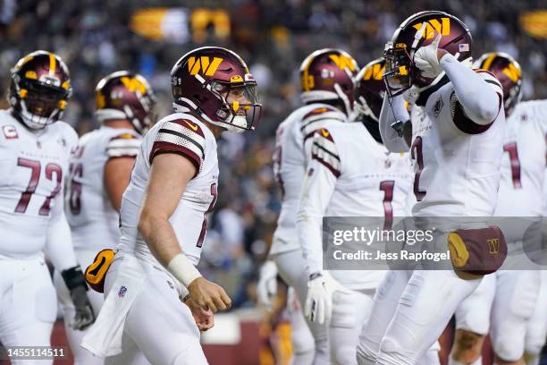 Sam Howell of the Washington Commanders celebrates a touchdown during the third quarter of the game against the Dallas Cowboys at FedExField on...