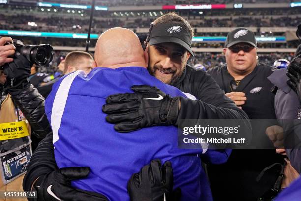 Head coach Nick Sirianni of the Philadelphia Eagles hugs head coach Brian Daboll of the New York Giants after Philadelphia's 22-16 win at Lincoln...